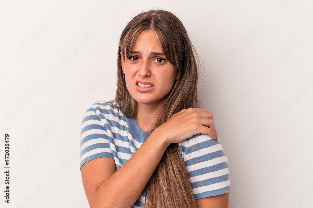Young caucasian woman isolated on white background having a shoulder pain. Young caucasian woman isolated on white background having a shoulder pain.