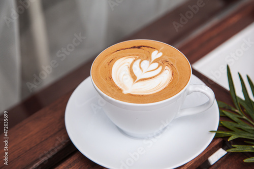 Hot art latte in white cup 