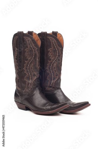 Leather cowboy boots on white background