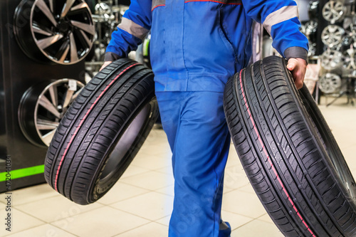 new summer tires are carried by the seller to the buyer or the tire fitter. new purchase and seasonal tire change