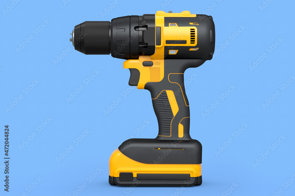 Fototapeta premium Cordless drill or yellow screwdriver isolated on blue background