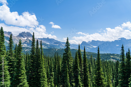 View of the Garden Wall, Grinnell Glacier Overlook, and the Continental Divide while hiking the Highline Trail in Glacier National Park in Montana on a sunny summer day photo
