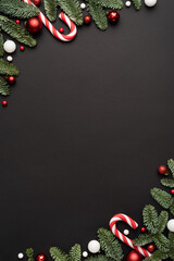 Christmas frame for text with fir decorations on black background