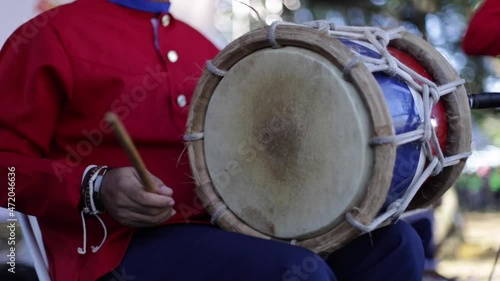man playing instrument tambora merengue in dominican republic photo