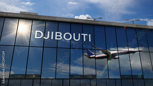 Airplane landing at Djibouti Jibuti airport mirrored in terminal photo
