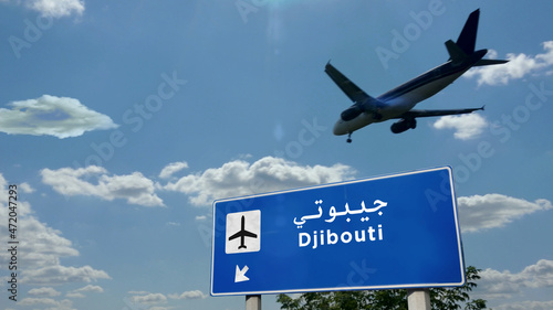 Plane landing in Djibouti Jibuti airport with signboard photo