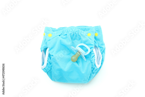 Concept of baby clothes with reusable diapers isolated on white background