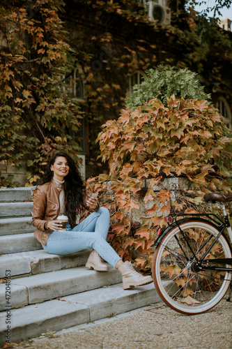 Young woman with mobile pho...