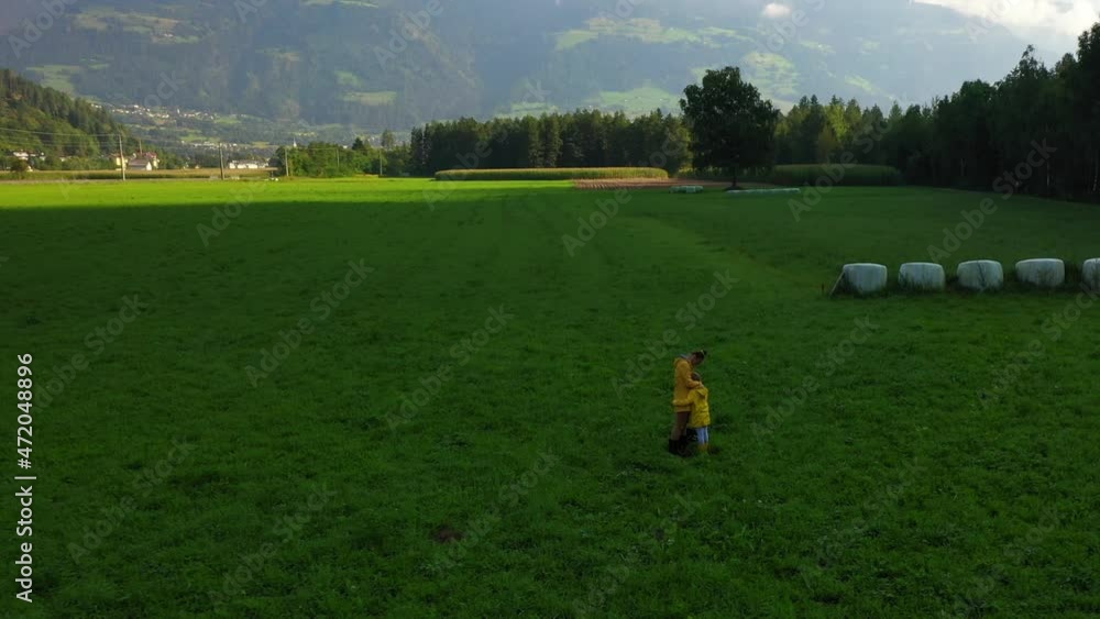 Mother and small daughter in the field in early autumn. Mother and small daughter in the field in early autumn.
