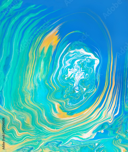 Abstract ocean - art background.Fantastic blue and green colors that merge into one  with the addition of gold.Creative artistic spilling of colors.
