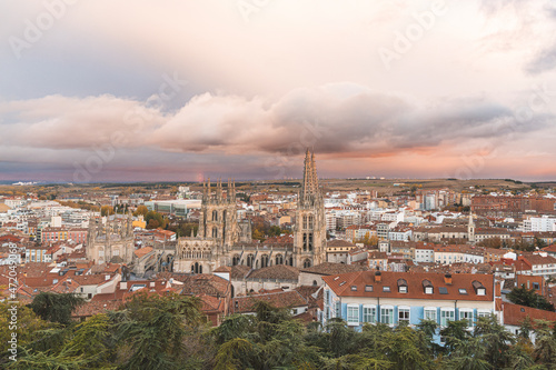 Spain, Province of Burgos, Castile and Leon, Cathedral of Saint Mary of Burgos and surrounding buildings at dusk photo