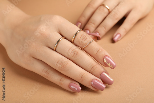 Concept of hand care on beige background