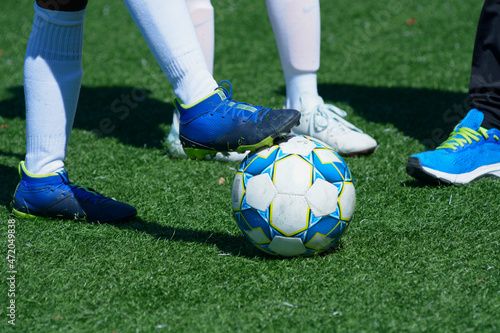 Women soccer players preparing for match on a soccer field. Nike, Select, Adidas. photo