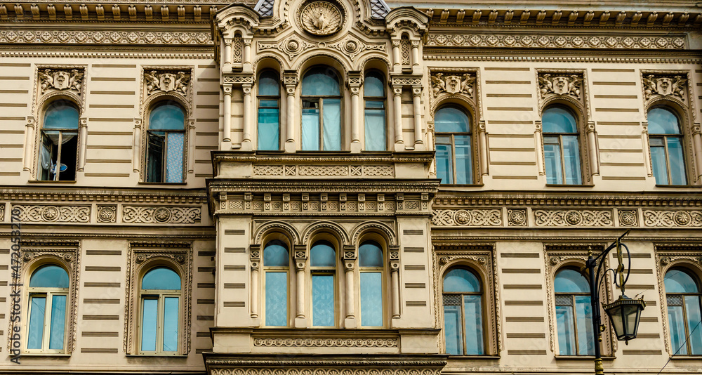 The facade of an old house with stucco.