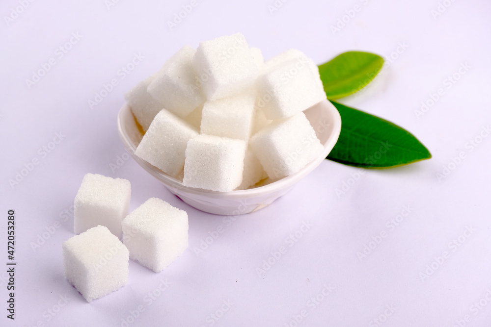 Sugar cubes.Cube sugar background, Sugar cubes in white bowl, isolated on white background. Sugar cubes.Cube sugar background, Sugar cubes in white bowl, isolated on white background.