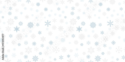 Seamless winter background with snowflakes