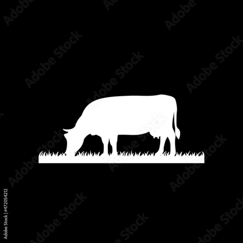 Cow is eating grass icon isolated on dark background