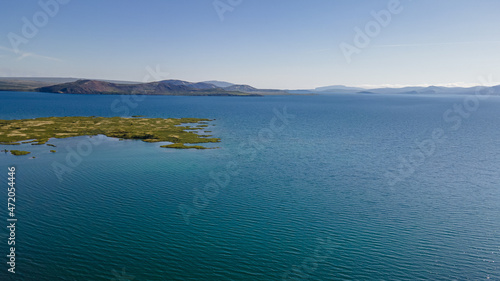 View of Thingvellir national park, Iceland's parliament, the Thingvellir Church and the ruins of old stone shelters, hikes and lake