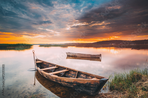 Braslaw Or Braslau, Vitebsk Voblast, Belarus. Wooden Rowing Fishing Boats In Beautiful Summer Sunset On The Dryvyaty Lake. This Is The Largest Lake Of Braslav Lakes. Typical Nature Of Belarus