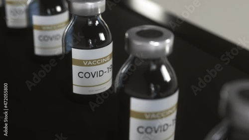 Wallpaper Mural Covid-19 vaccine manufacturing,bottles vials passing on conveyor belt Torontodigital.ca