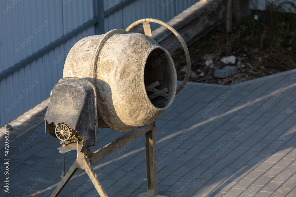 Concrete mixer at a construction site. Concrete mixer at a construction site.