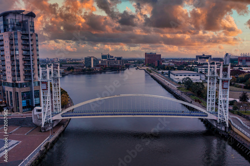 Fototapeta Naklejka Na Ścianę i Meble -  Aerial view of the Media City UK is on the banks of the Manchester Ship Canal in Salford and Trafford, Greater Manchester, England at dusk.
