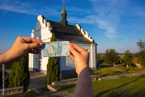 ive hryvnia, Ukrainian banknote with the picture of the famous St. Elijah Church. This church situated in Subotiv village near Chyhyryn city, Cherkasy region, Ukraine. photo