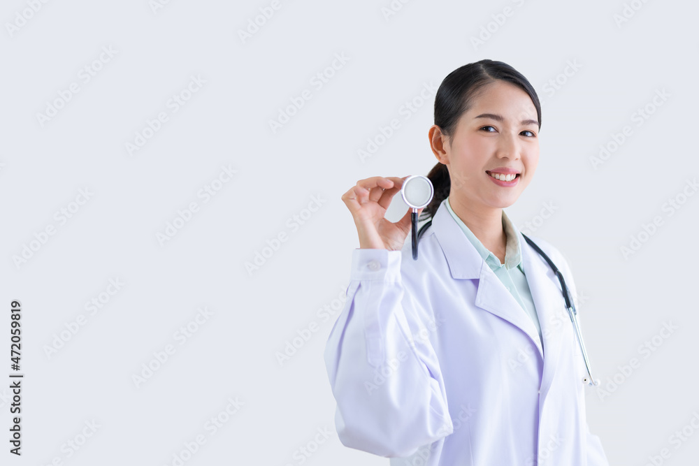 Asian female doctor smiling in lab hand holding medical tools with white background Asian female doctor smiling in lab hand holding medical tools with white background