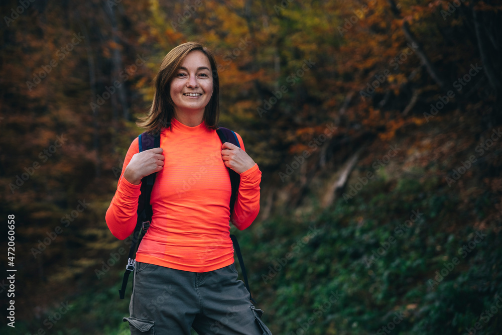 Smiling hiker with backpack at forest Smiling hiker with backpack at forest