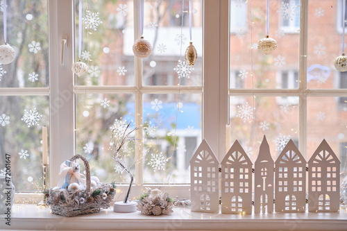 Photography winter decor on windowsill with decor, basket with Christmas balls