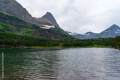 View of Fishercap Lake at Swiftcurrent and Many Glacier on the Continental Divide Trail in Glacier National Park in Montana in the summer photo