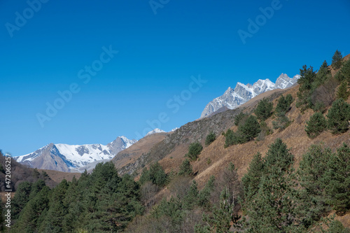 Scenic autumn mountain landscape with snow peaks, Digor Gorge, Northern Ossetia, Caucasus, Russia