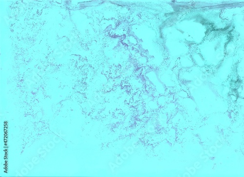 Turquoise watercolor background. Transparent lines and spots. Paint leaks and ombre effects. Abstract hand-painted image.
