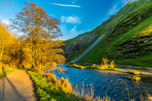 A view at sunset down the River Dove at Dovedale, UK on a sunny Autumn evening photo