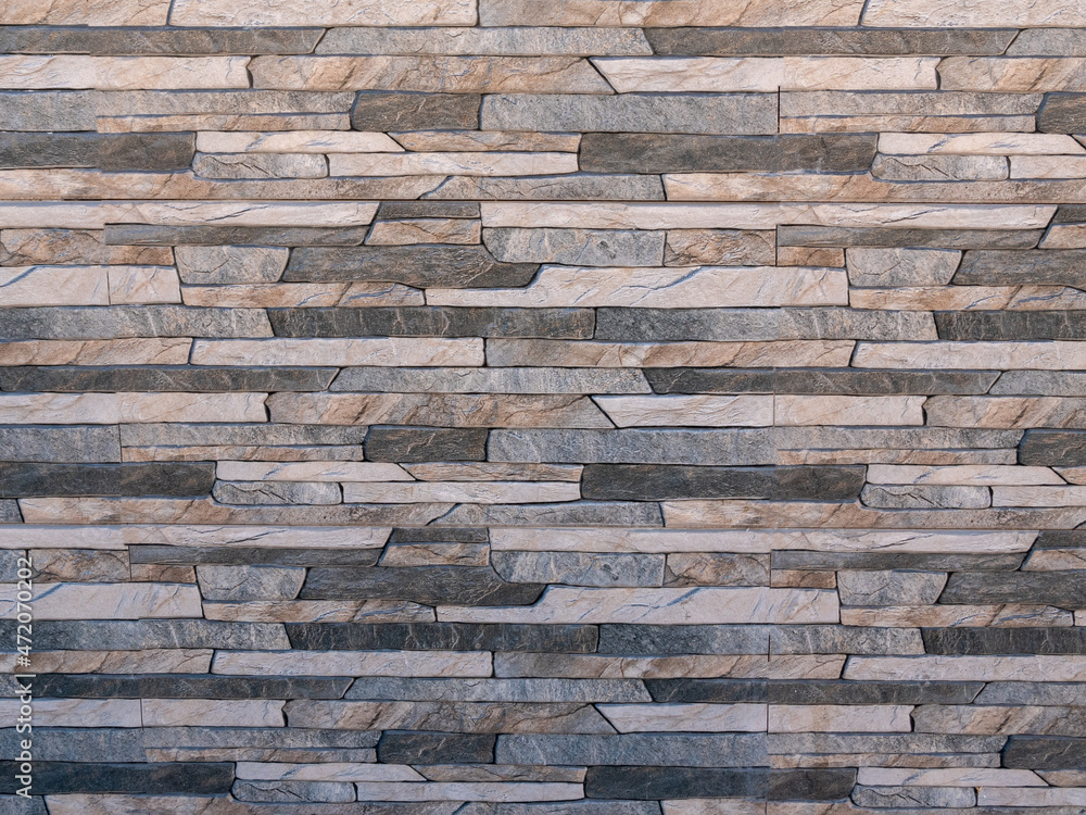 Background. Stone wall of multi-colored natural stone with beautiful texture. Background. Stone wall of multi-colored natural stone with beautiful texture.