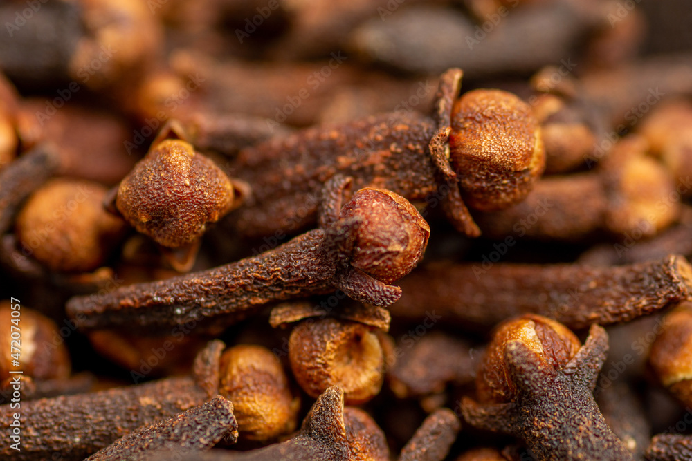 clove dried spicy herb for food aroma and natural medicine close up. clove dried spicy herb for food aroma and natural medicine close up.