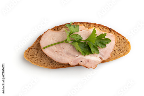 Smoked pork ham sandwich isolated on white background. Top view, close up.