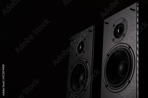 professional studio monitors with high sound quality, speaker system for music lovers on a black background