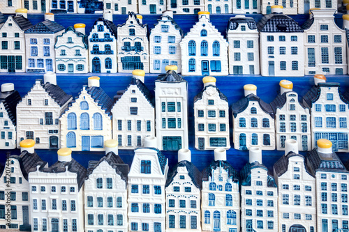 Famous souvenir - traditional blue porcelain houses background. European vintage Dutch houses in souvenir shop background. photo