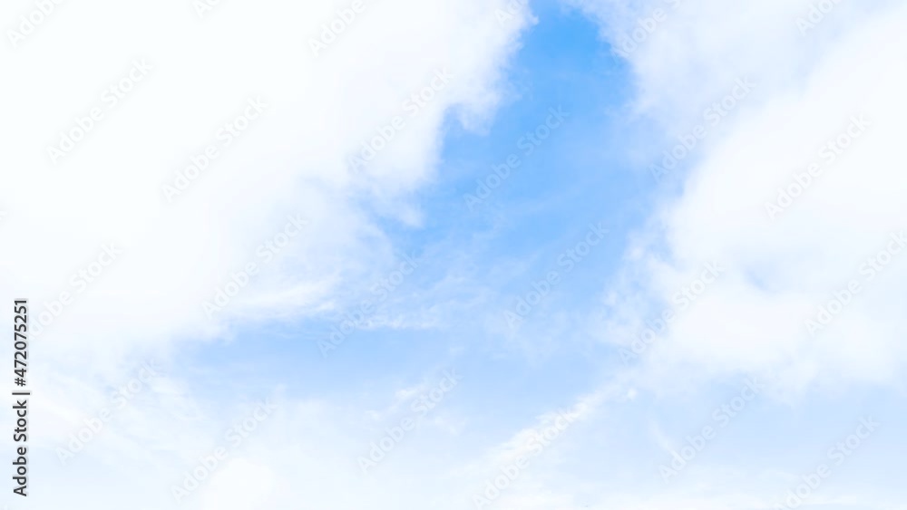 Light white clouds fly across a bright blue sky. Clear sky at sunny summer afternoon. Spring cloudscape background. Copy space at Phuket Thailand. Light white clouds fly across a bright blue sky. Clear sky at sunny summer afternoon. Spring cloudscape background. Copy space at Phuket Thailand.