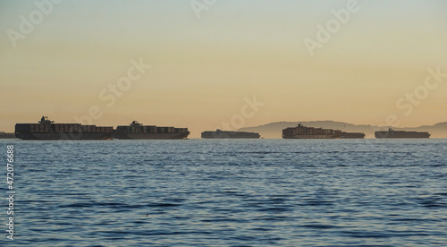Fotografie Numerous container ships crowd the anchorage at the Port of Long Beach, waiting