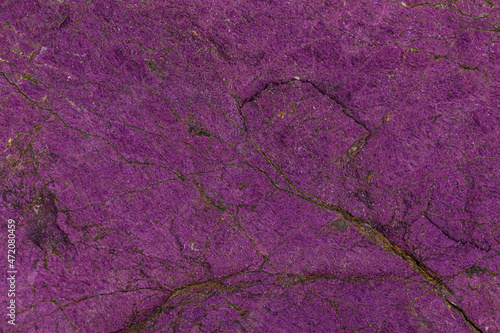 Macro mineral stone purpureus, (purple) purpurite in the breed a white background photo