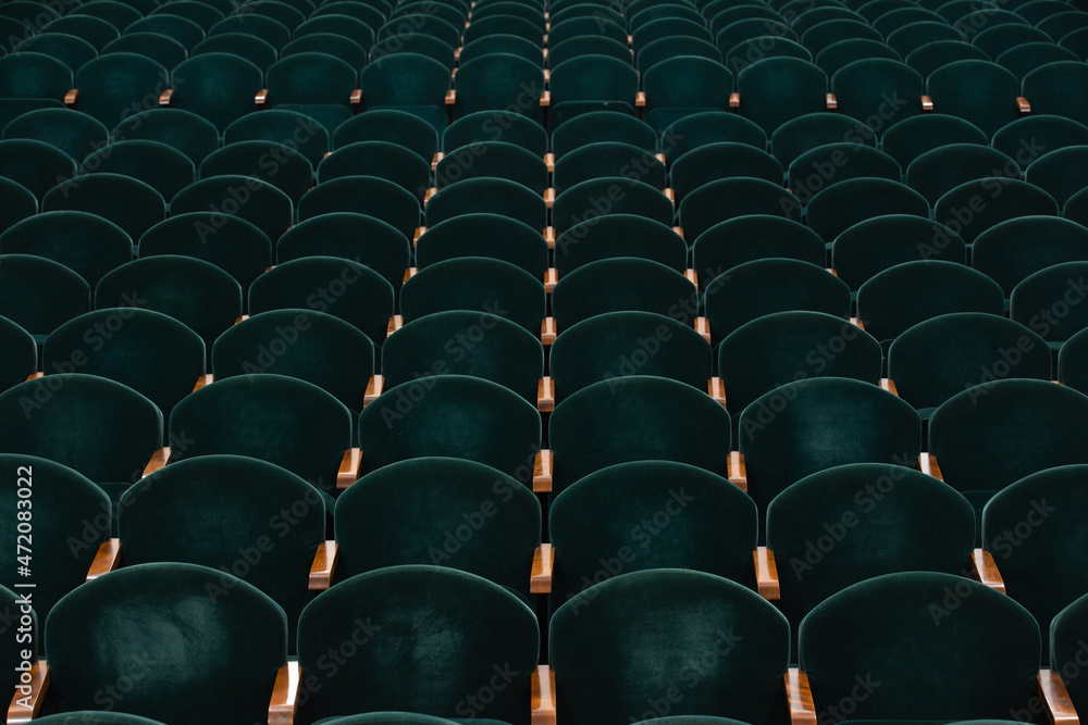 Fototapeta premium rows of soft velvet armchairs in the theater auditorium