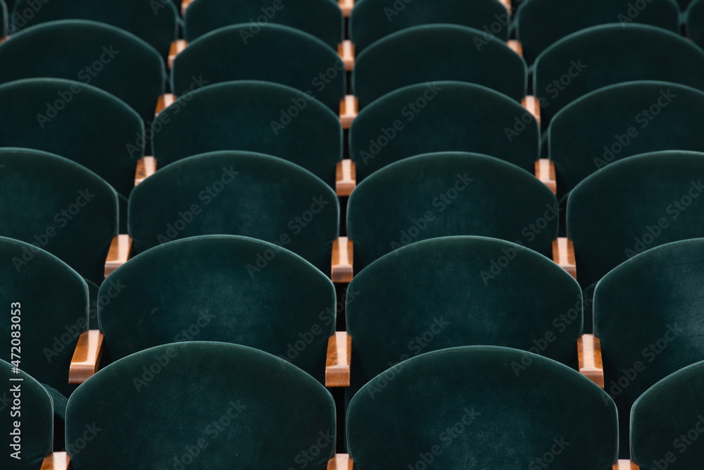 Obraz premium rows of soft velvet armchairs in the theater auditorium