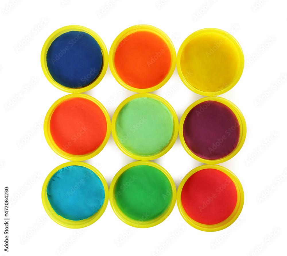 Plastic containers with colorful play dough on white background, top view Plastic containers with colorful play dough on white background, top view