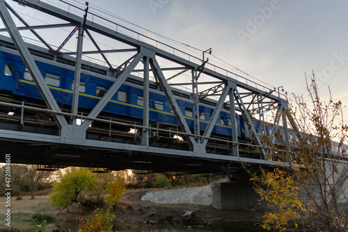 railroad and railway bridge and a passing passenger train