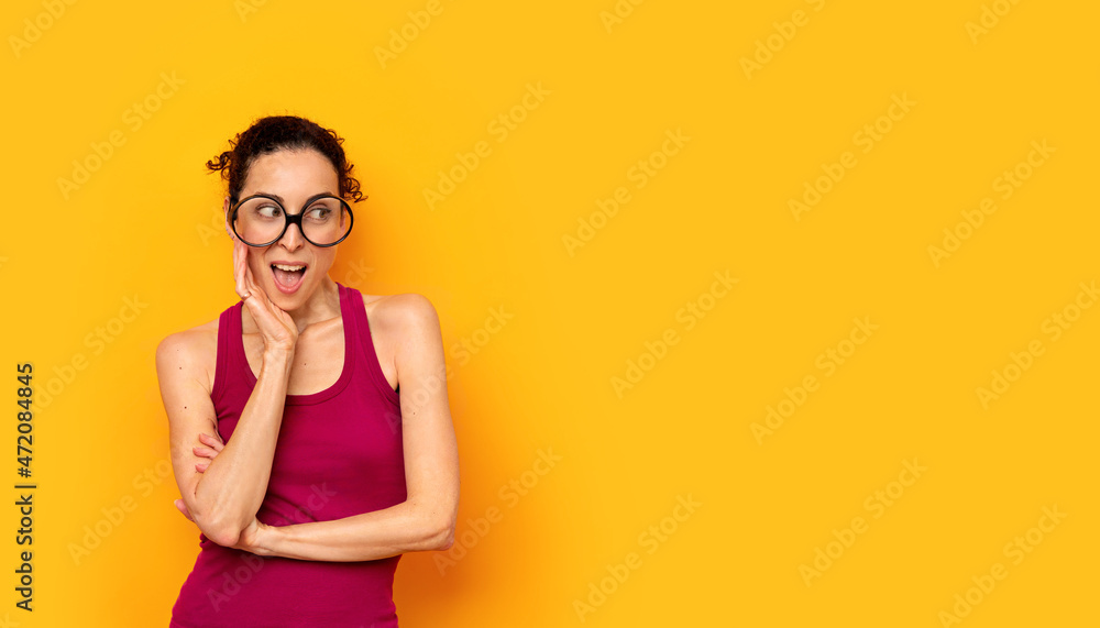 Young woman with big glasses and a wow surprise expression Young woman with big glasses and a wow surprise expression