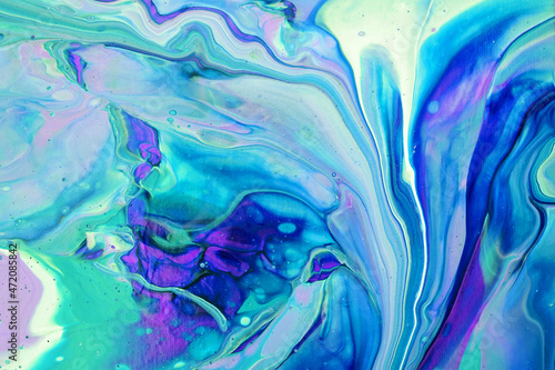 Fluid art painting. Abstract decorative marble texture. Background with liquid acrylic. Mixed paints for poster or wallpaper. Modern art. White, purple, blue, green and turquoise colors.