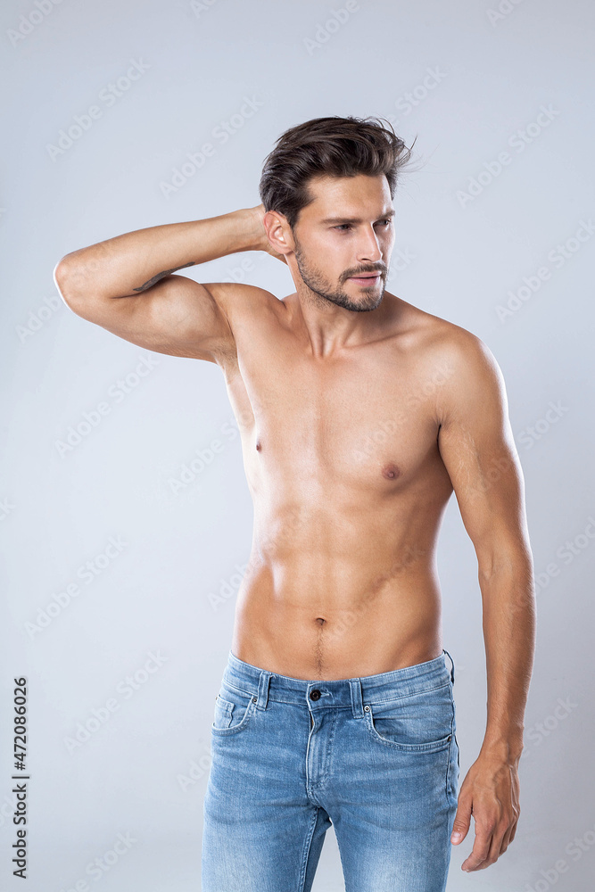 Handsome man in jeans without a shirt