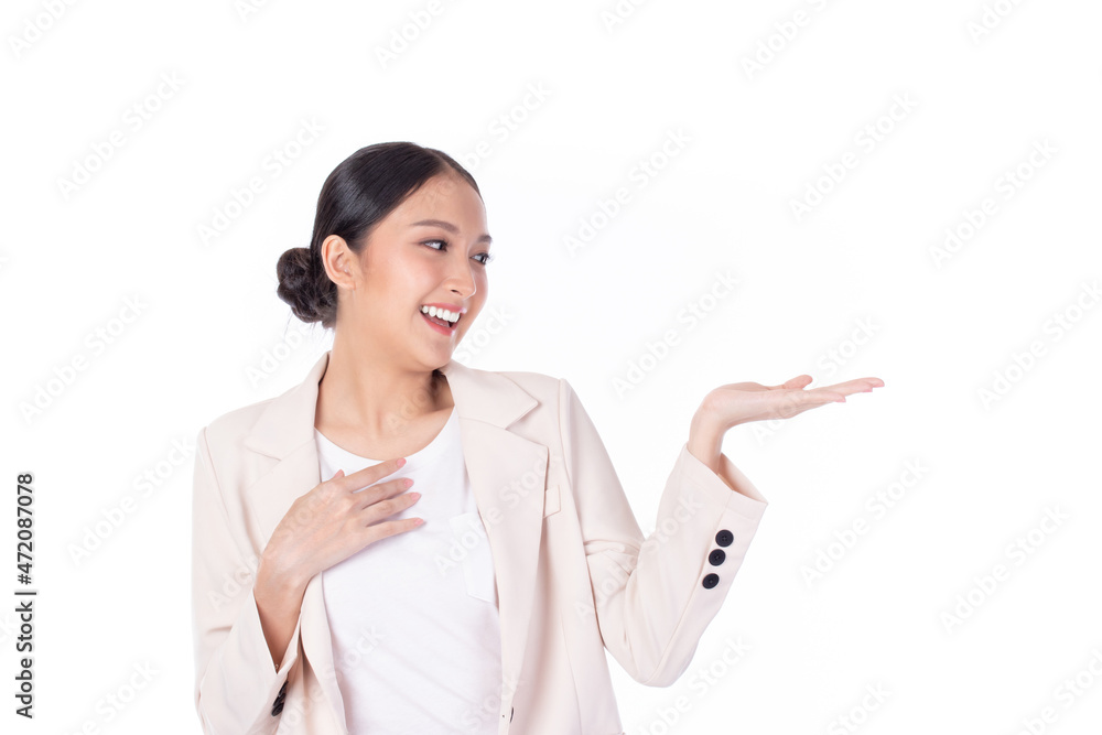 Beautiful Asian woman wearing casual clothes smile and pointing finger to an empty palm isolated on white background studio portrait. Beautiful Asian woman wearing casual clothes smile and pointing finger to an empty palm isolated on white background studio portrait.